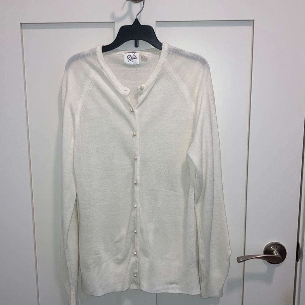Women’s white long sleeve cardigan sweater.
